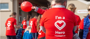 Parents and children wearing 'I'm a heart hero' t-shirts